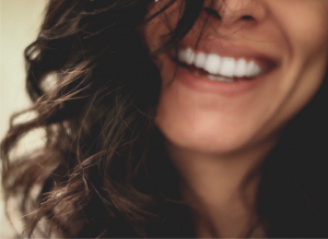 closeup of a woman smiling with clean teeth