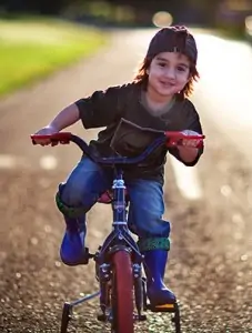 Young boy riding his bike