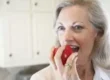 Woman eating an apple