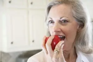 Woman eating an apple