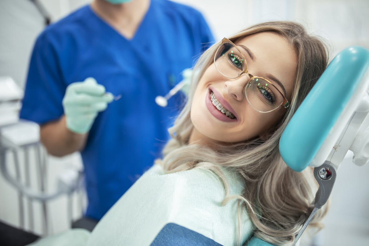 Adult woman with braces in a dental chair